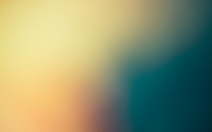 Abstract gradient of yellow, orange, and teal