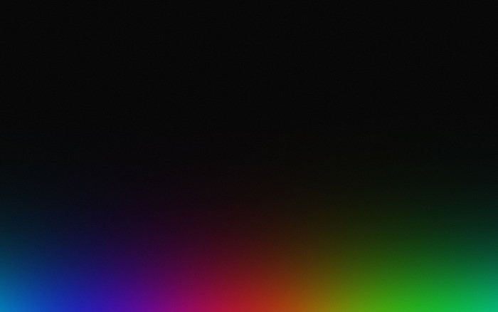 Abstract gradient of rainbow colors on black