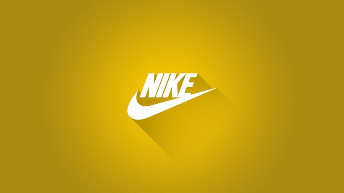 Nike logo with swoosh on yellow background