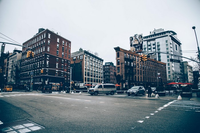 Street intersection with buildings and traffic