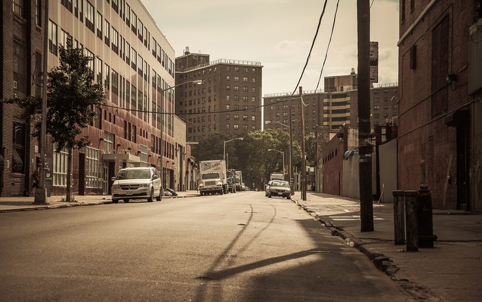 Street scene with cars and apartment buildings