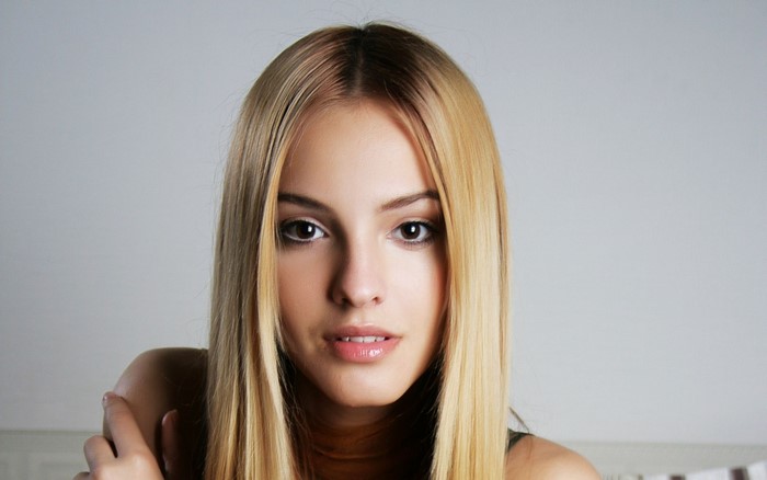Young woman with blonde hair and brown eyes