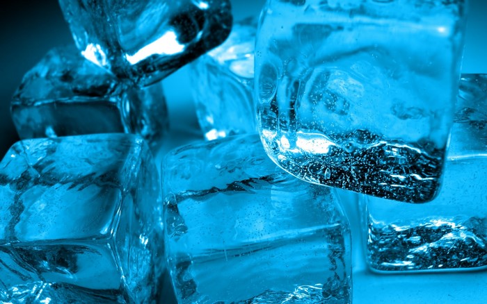 Close-up of blue ice cubes with bubbles