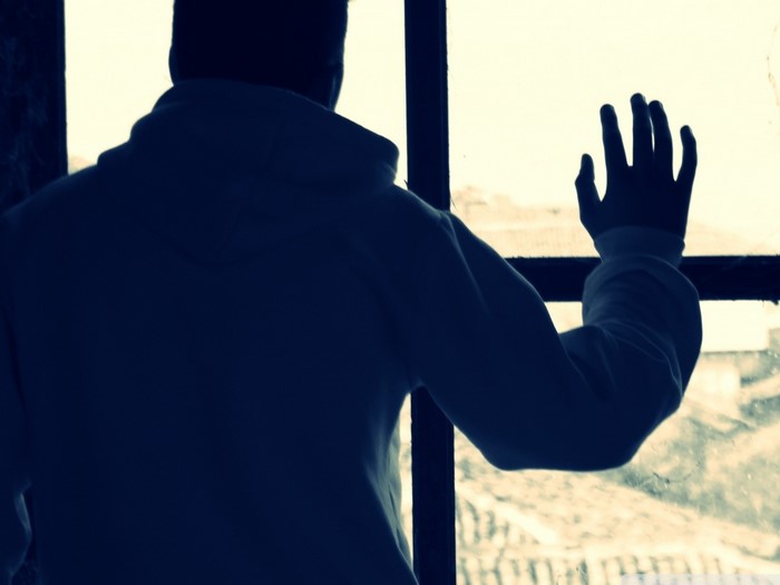 Man looking out a window