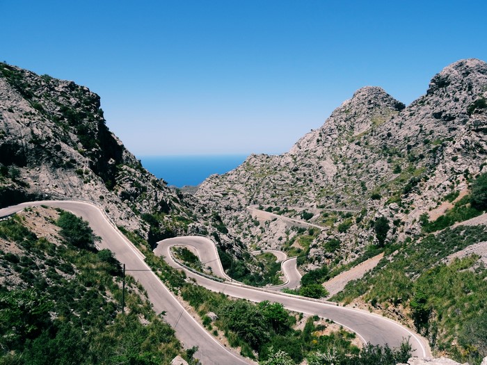 Winding mountain road overlooking the sea