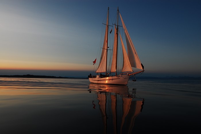 Sailboat on the water at sunset