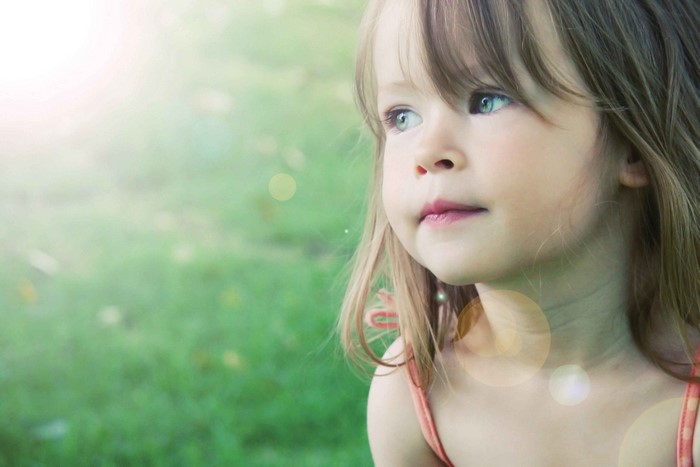 Sad Thoughtful Little Girl in Soft Natural Light