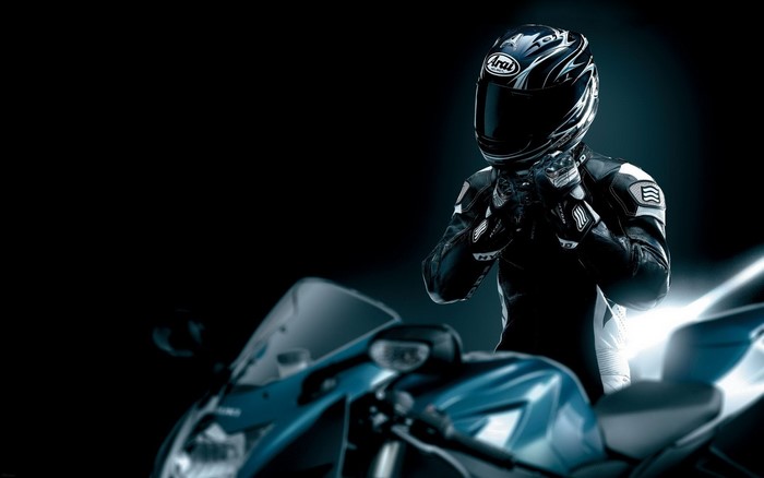 Motorcycle Racer in Arai Helmet and Leather Suit