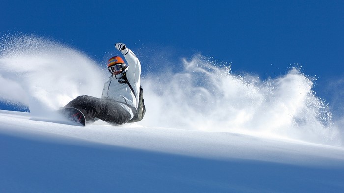 Snowboarder in action on a snowy slope