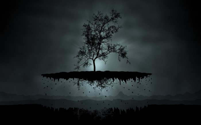Floating island with a silhouetted tree
