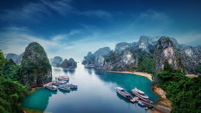 Ha Long Bay with boats and limestone karsts