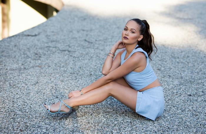 Kelli Berglund sitting on gravel