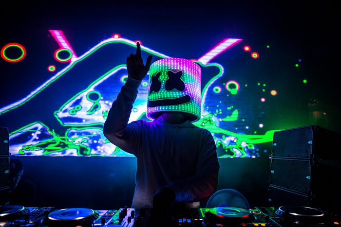 DJ Marshmello Performing with Vibrant Neon Lights