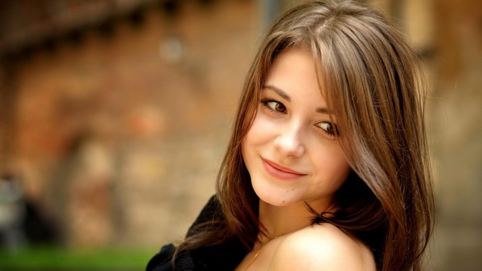 Young woman with brown hair and brown eyes