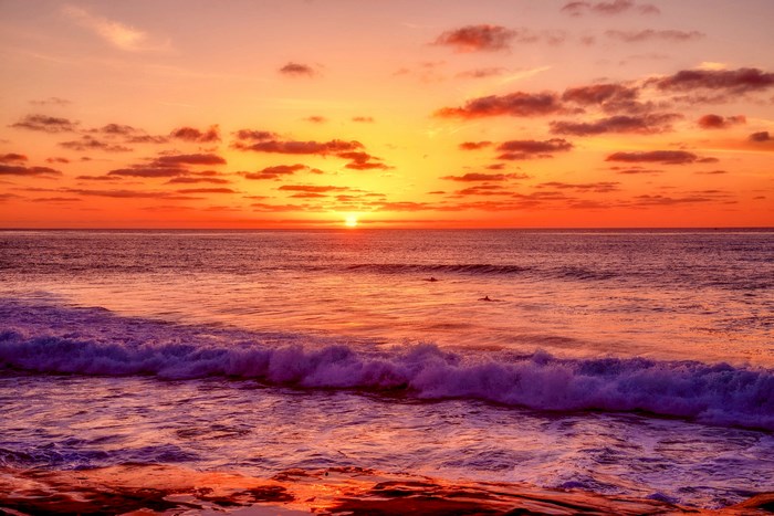 Ocean sunset with waves and clouds