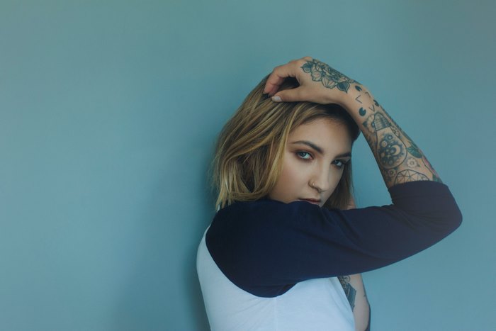 Woman with tattoos and blonde hair
