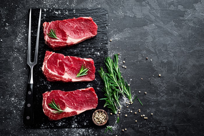 Fresh Raw Steaks with Herbs and Seasoning