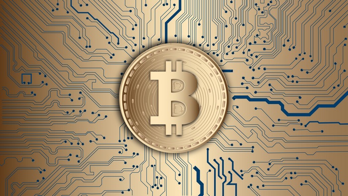 Golden Bitcoin Coin with Digital Circuit Board