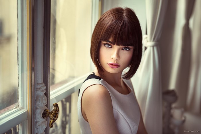Model Marie Grippon with short brown hair and blue eyes