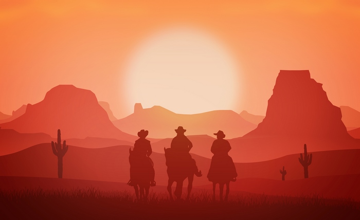 Cowboys on Horses in the Wild West at Sunset
