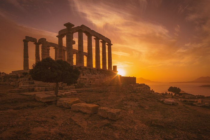 Temple of Poseidon ruins at sunset, Cape Sounio, Greece