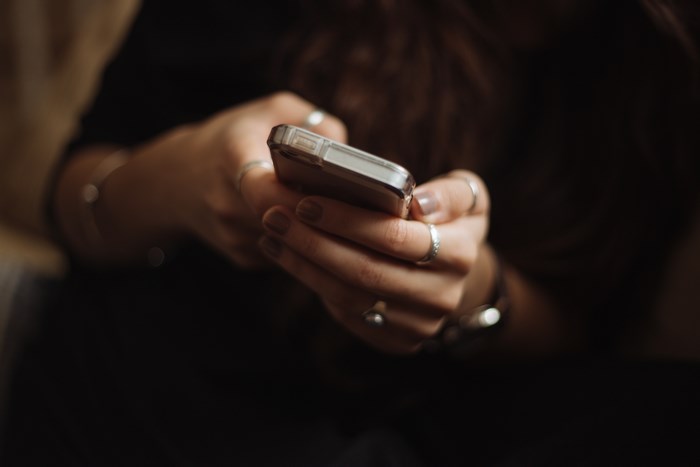 Woman texting on a smartphone