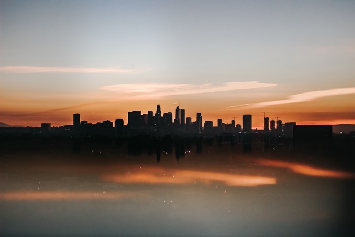 Los Angeles skyline at sunset with reflections