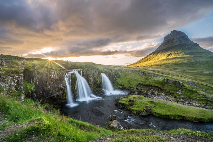 Kirkjufell mountain and waterfall in Iceland at sunset