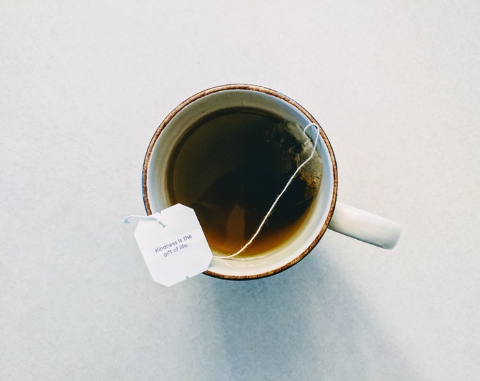 Tea bag with message in a mug of tea