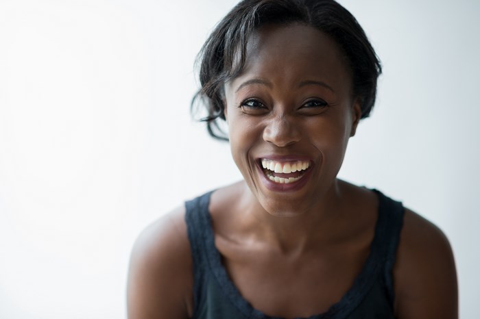 Black woman laughing with joy