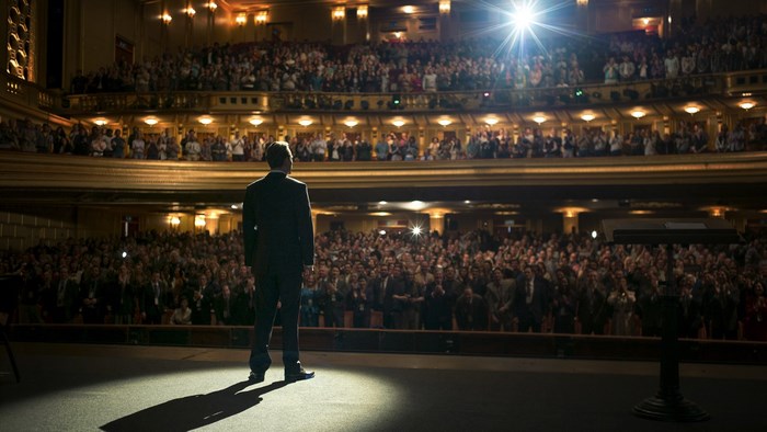 Steve Jobs on stage in front of an audience