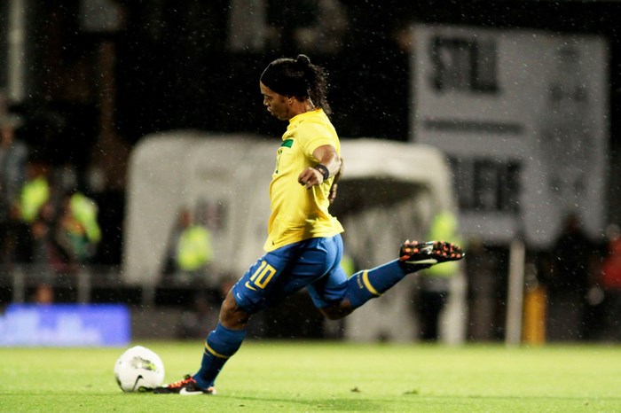 Ronaldinho playing soccer in Brazil uniform