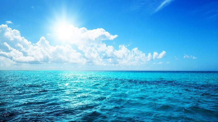 Ocean and Sky with Sun and Clouds