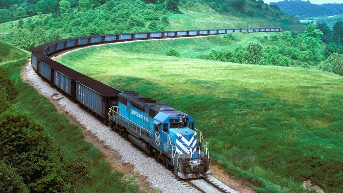Blue train with coal cars on a curved track