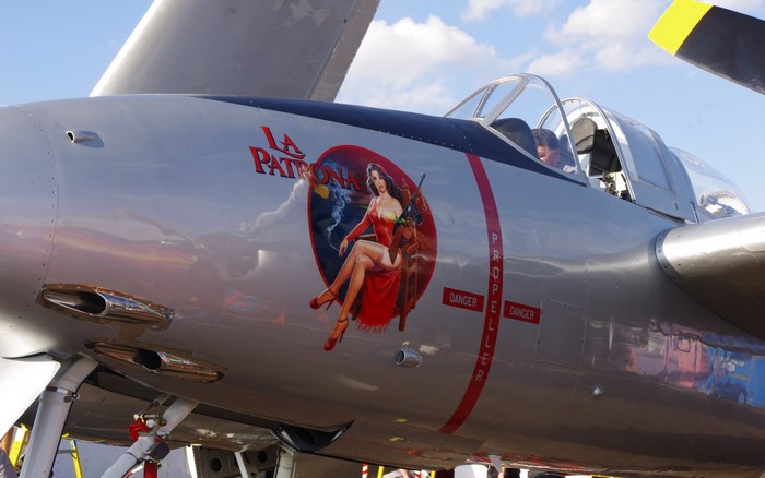 La Patrona nose art on a silver airplane