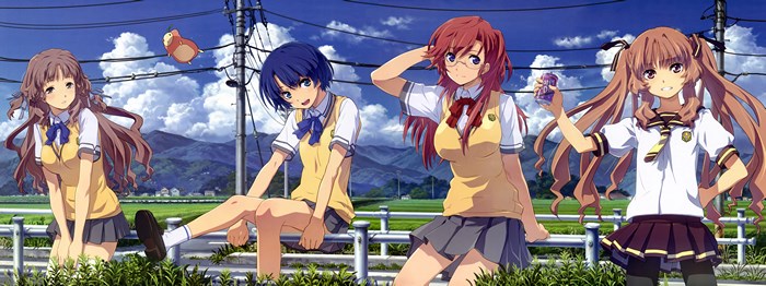 Four schoolgirls waiting by a fence in summer