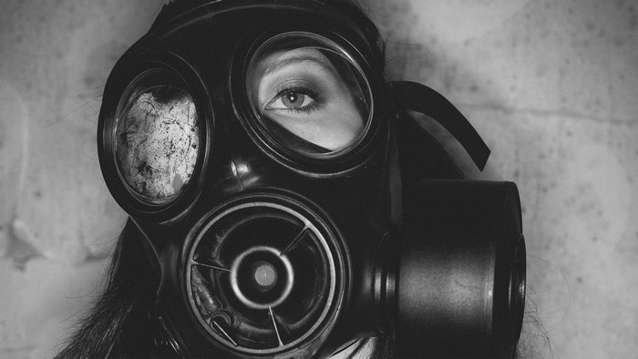 Woman wearing a gas mask