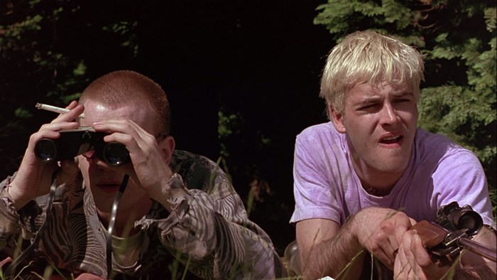 Trainspotting: Two men with binoculars and a rifle