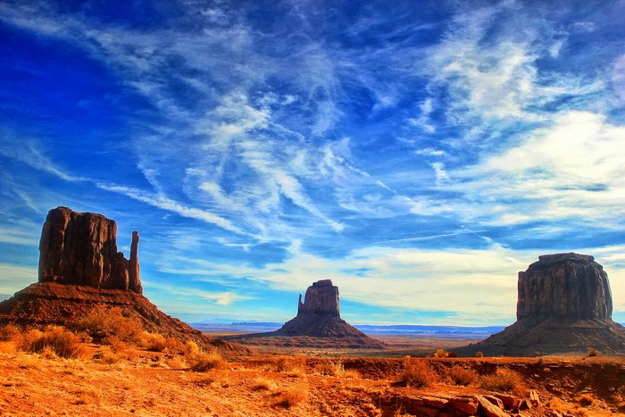 Monument Valley landscape with mesas and blue sky