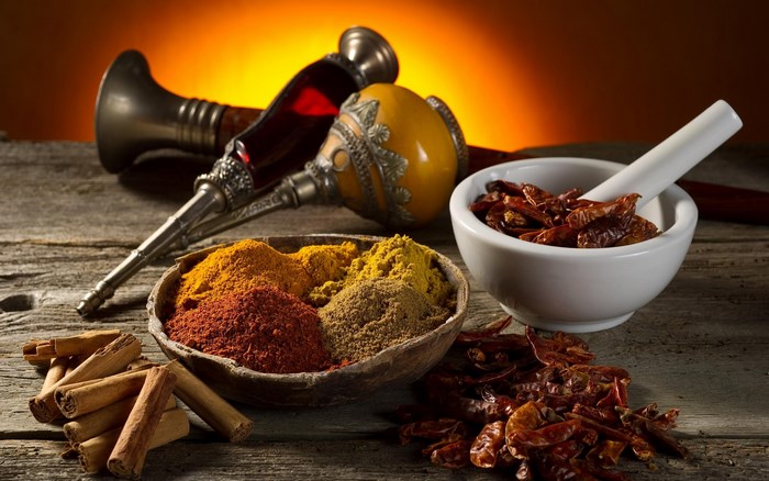 Assorted Colorful Spices and Dried Chilies on Wood