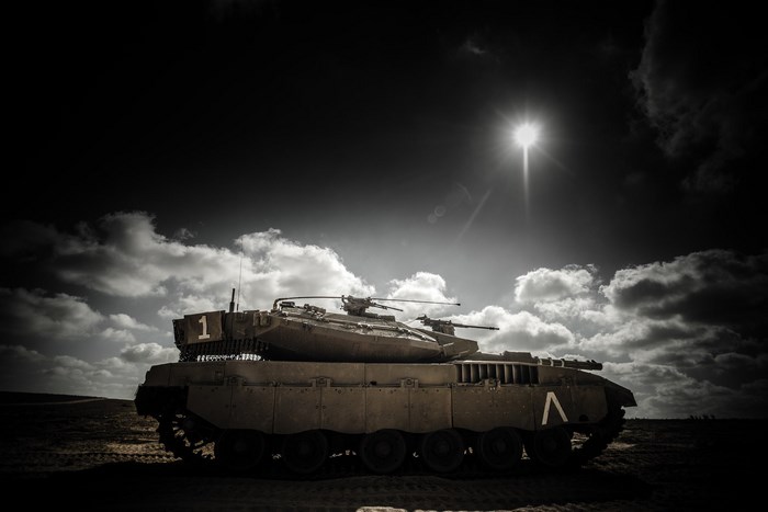 Merkava tank under a dramatic sky