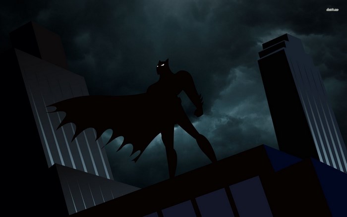 Batman on a rooftop at night