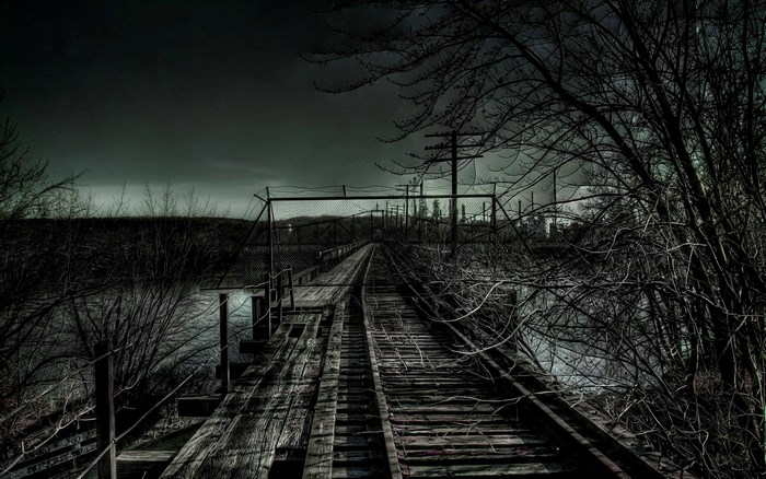 Abandoned railroad bridge over water