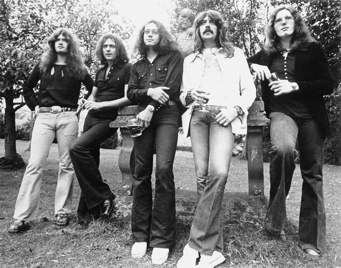 Deep Purple band members posing outdoors