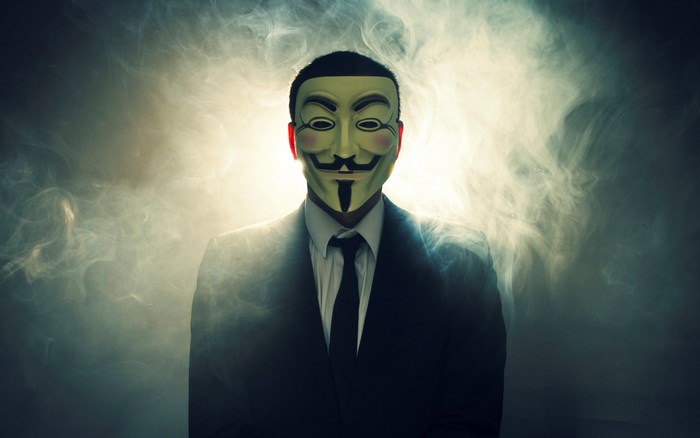 Man in Anonymous mask and suit