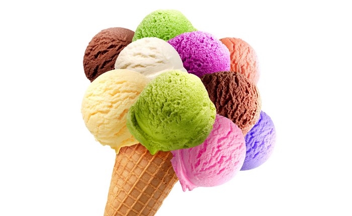 Assorted scoops of ice cream in a cone