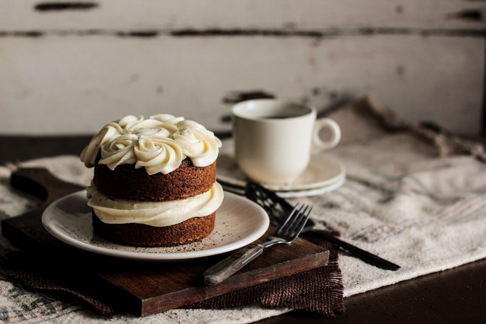 Miniature cake with frosting and coffee