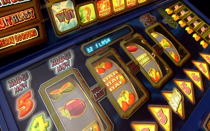 Slot machine with fruit symbols and flashing lights