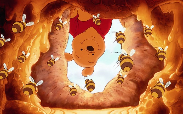Winnie the Pooh and bees in a beehive