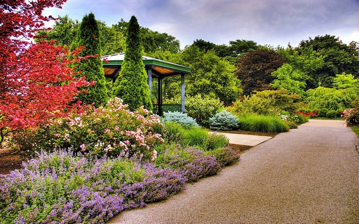 Beautiful garden with a gazebo and colorful flowers